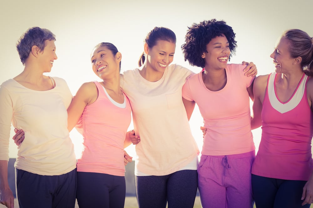 Laughing women wearing pink